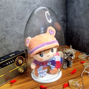 عروسک بچه کلاه دار گلبهی در باکس خمره ای